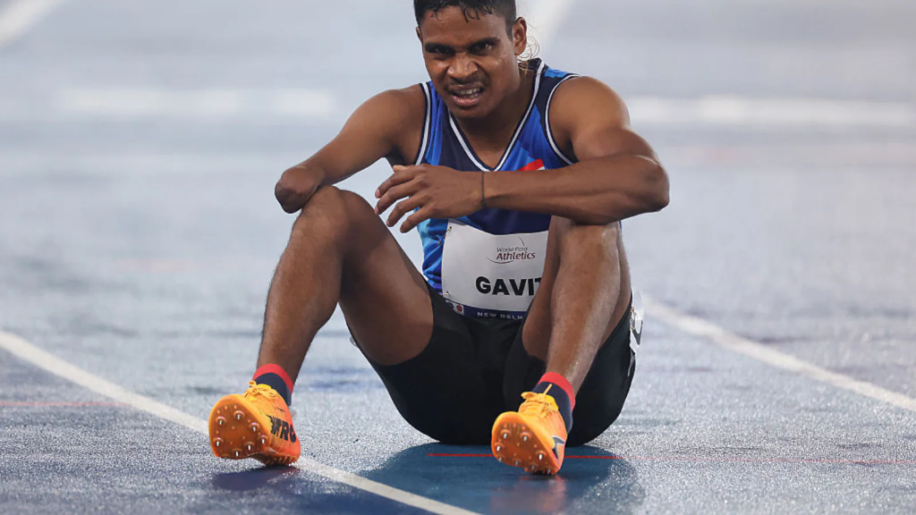 दिलीप गावित (Dilip Gavit) Real Photo Sitting on Track Showing Right Arm Amputation and GAVIT Bib